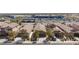 Neighborhood street view showcasing well-maintained homes near commercial centers and gas station at 7137 Flowering Rose Ave, Las Vegas, NV 89117