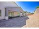 This backyard features an open space with a covered patio at 8863 Italian Trotter Ct, Las Vegas, NV 89113