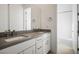 The bathroom features double sinks with matching granite countertops at 8863 Italian Trotter Ct, Las Vegas, NV 89113