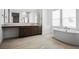 Bright bathroom with a modern soaking tub, dual vanities, and ample counter space, offering a spa-like experience at 8863 Italian Trotter Ct, Las Vegas, NV 89113