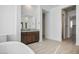 Modern bathroom featuring a stand-alone tub, dual vanities, and contemporary finishes for a luxurious feel at 8863 Italian Trotter Ct, Las Vegas, NV 89113