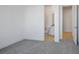 Bedroom with neutral carpet leading into the bathroom at 8863 Italian Trotter Ct, Las Vegas, NV 89113