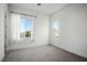 Bright bedroom with a window and neutral colored carpet at 8863 Italian Trotter Ct, Las Vegas, NV 89113