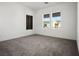 Bedroom with neutral carpet and two windows at 8863 Italian Trotter Ct, Las Vegas, NV 89113