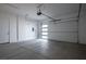 Spacious two car garage with concrete floors and white walls at 8863 Italian Trotter Ct, Las Vegas, NV 89113