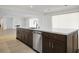 Spacious kitchen island featuring stainless steel appliances, wood cabinets and white countertops at 8863 Italian Trotter Ct, Las Vegas, NV 89113