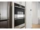 Modern kitchen featuring stainless steel double ovens and stainless steel refrigerator at 8863 Italian Trotter Ct, Las Vegas, NV 89113