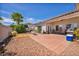 Spacious backyard with brick patio, barbecue grill, and desert landscaping at 90 Ancient Hills Ln, Henderson, NV 89074