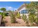 Backyard features low maintenance desert landscaping, rock ground cover, and block wall at 90 Ancient Hills Ln, Henderson, NV 89074