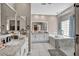 Bright primary bathroom with double sinks, soaking tub, and spacious shower at 90 Ancient Hills Ln, Henderson, NV 89074
