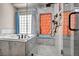 Modern bathroom features a soaking tub and tiled shower with glass enclosure at 90 Ancient Hills Ln, Henderson, NV 89074