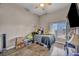 Bedroom with a ceiling fan and wood flooring, offering a comfortable and inviting space at 90 Ancient Hills Ln, Henderson, NV 89074