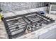 Whirlpool stainless steel stovetop features a stylish backsplash and marble countertops at 90 Ancient Hills Ln, Henderson, NV 89074