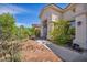 Well-kept home showcasing beautiful landscaping and a welcoming front entrance, perfect for any homeowner at 90 Ancient Hills Ln, Henderson, NV 89074