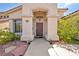 Charming front entrance with a well-manicured yard and desert-friendly landscaping adding to its appeal at 90 Ancient Hills Ln, Henderson, NV 89074