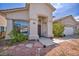 Inviting front entrance with stone accents and desert landscaping for a charming curb appeal at 90 Ancient Hills Ln, Henderson, NV 89074