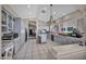 Open kitchen featuring grey cabinets, lots of counter space, and modern appliances at 90 Ancient Hills Ln, Henderson, NV 89074