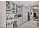 Bright kitchen with white floors, gray cabinets, and black appliances at 90 Ancient Hills Ln, Henderson, NV 89074