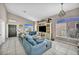 Large living room with tile floors, vaulted ceilings and comfortable blue couches at 90 Ancient Hills Ln, Henderson, NV 89074