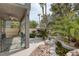 Backyard with rock waterfall and stone patio at 9705 Floweret Ave, Las Vegas, NV 89117