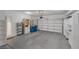 Spacious garage with storage cabinets and shelving, offering ample parking and organization space at 9705 Floweret Ave, Las Vegas, NV 89117