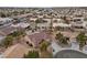 An aerial view of neighborhood featuring desert landscaping, mature trees and beautiful tile roofs at 9917 Arbuckle Dr, Las Vegas, NV 89134