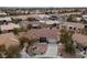 An aerial view of neighborhood with desert landscaping and well maintained homes at 9917 Arbuckle Dr, Las Vegas, NV 89134