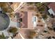 An aerial view of home features tile roof, desert landscaping, and a tranquil backyard at 9917 Arbuckle Dr, Las Vegas, NV 89134