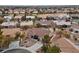 An aerial view of neighborhood showcasing mature trees and well maintained tile roofs at 9917 Arbuckle Dr, Las Vegas, NV 89134