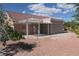 Backyard featuring a covered patio and desert landscaping at 9917 Arbuckle Dr, Las Vegas, NV 89134
