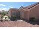Charming home featuring a tile roof, desert landscaping, and a cozy screened in porch at 9917 Arbuckle Dr, Las Vegas, NV 89134