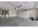 Spacious garage features built in white cabinets, laundry area and ample room for storage and parking at 9917 Arbuckle Dr, Las Vegas, NV 89134