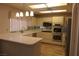 Modern kitchen with white countertops, stainless steel appliances, and sleek, updated finishes at 9917 Arbuckle Dr, Las Vegas, NV 89134