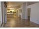 Open-concept living area with hardwood floors, connecting to the kitchen and patio at 9917 Arbuckle Dr, Las Vegas, NV 89134