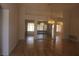 Bright living room with hardwood floors and mirrors reflecting natural light at 9917 Arbuckle Dr, Las Vegas, NV 89134