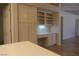 Convenient office nook with built-in desk and cabinetry, perfect for a home office or study space at 9917 Arbuckle Dr, Las Vegas, NV 89134