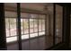 Enjoy the sunlight in this screened in sunroom with views of the landscaped backyard at 9917 Arbuckle Dr, Las Vegas, NV 89134