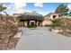 Charming community theater entrance featuring covered drop-off and lovely desert landscaping at 9917 Arbuckle Dr, Las Vegas, NV 89134