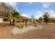 Front yard with mature trees and desert landscaping at 9917 Arbuckle Dr, Las Vegas, NV 89134