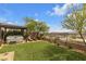 Beautiful backyard featuring a hot tub, artificial grass and desert landscaping at 109 Reverie Heights Ave, Henderson, NV 89011