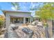 Inviting backyard patio featuring comfortable seating, lush landscaping, and a serene ambiance at 109 Reverie Heights Ave, Henderson, NV 89011