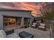 Stunning backyard featuring a covered patio, outdoor seating, and a luxurious hot tub for relaxation at 109 Reverie Heights Ave, Henderson, NV 89011