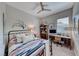 Inviting bedroom with a comfortable bed, ample storage, and a dedicated workspace by the window at 109 Reverie Heights Ave, Henderson, NV 89011