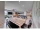 Open-concept dining and living area with a modern kitchen, pool table, and stylish decor throughout at 109 Reverie Heights Ave, Henderson, NV 89011