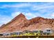 Beautiful new home exteriors nestled against a backdrop of stunning desert mountains at 109 Reverie Heights Ave, Henderson, NV 89011