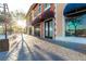 Picturesque storefronts with awnings on brick sidewalks bathed in warm sunlight at 109 Reverie Heights Ave, Henderson, NV 89011