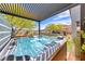 Relaxing hot tub under a pergola, set within a beautifully landscaped backyard oasis at 109 Reverie Heights Ave, Henderson, NV 89011
