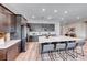 Modern kitchen featuring stainless steel appliances, large island with seating, and ample dark wood cabinet space at 109 Reverie Heights Ave, Henderson, NV 89011