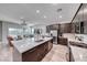 Bright open kitchen featuring a large island with white countertop, stainless steel appliances, and a modern design at 109 Reverie Heights Ave, Henderson, NV 89011