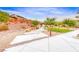 Scenic walkway with modern pavers surrounded by desert landscaping in a residential community at 109 Reverie Heights Ave, Henderson, NV 89011